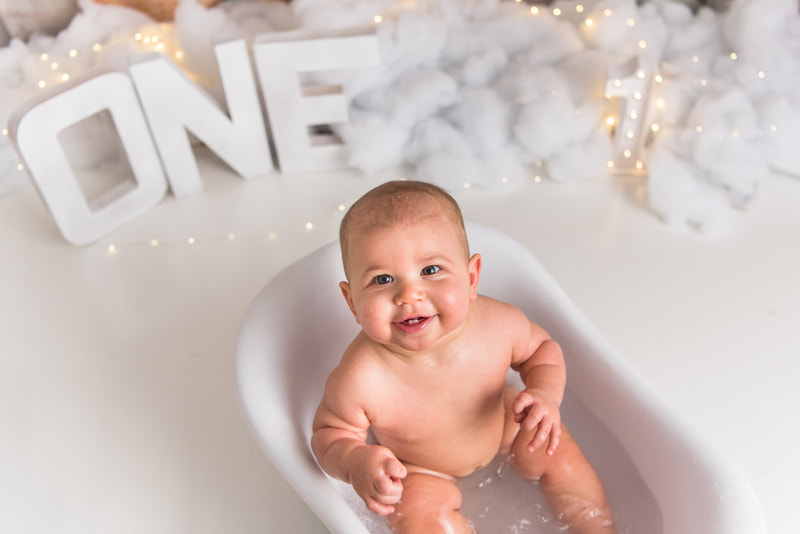 Baby playing in bath tub