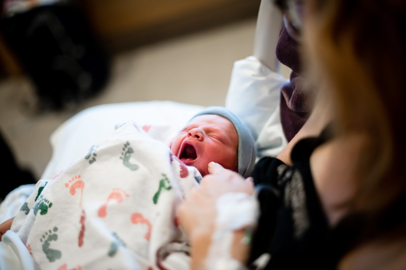 newborn baby at pittsburgh magee hospital yawning